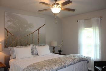 Designer light fixtures and ceiling fans in living rooms and bedrooms